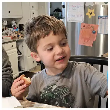 A candid phone photo of a young boy